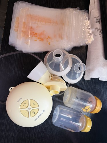 Medela swing breast pump - breast, and
